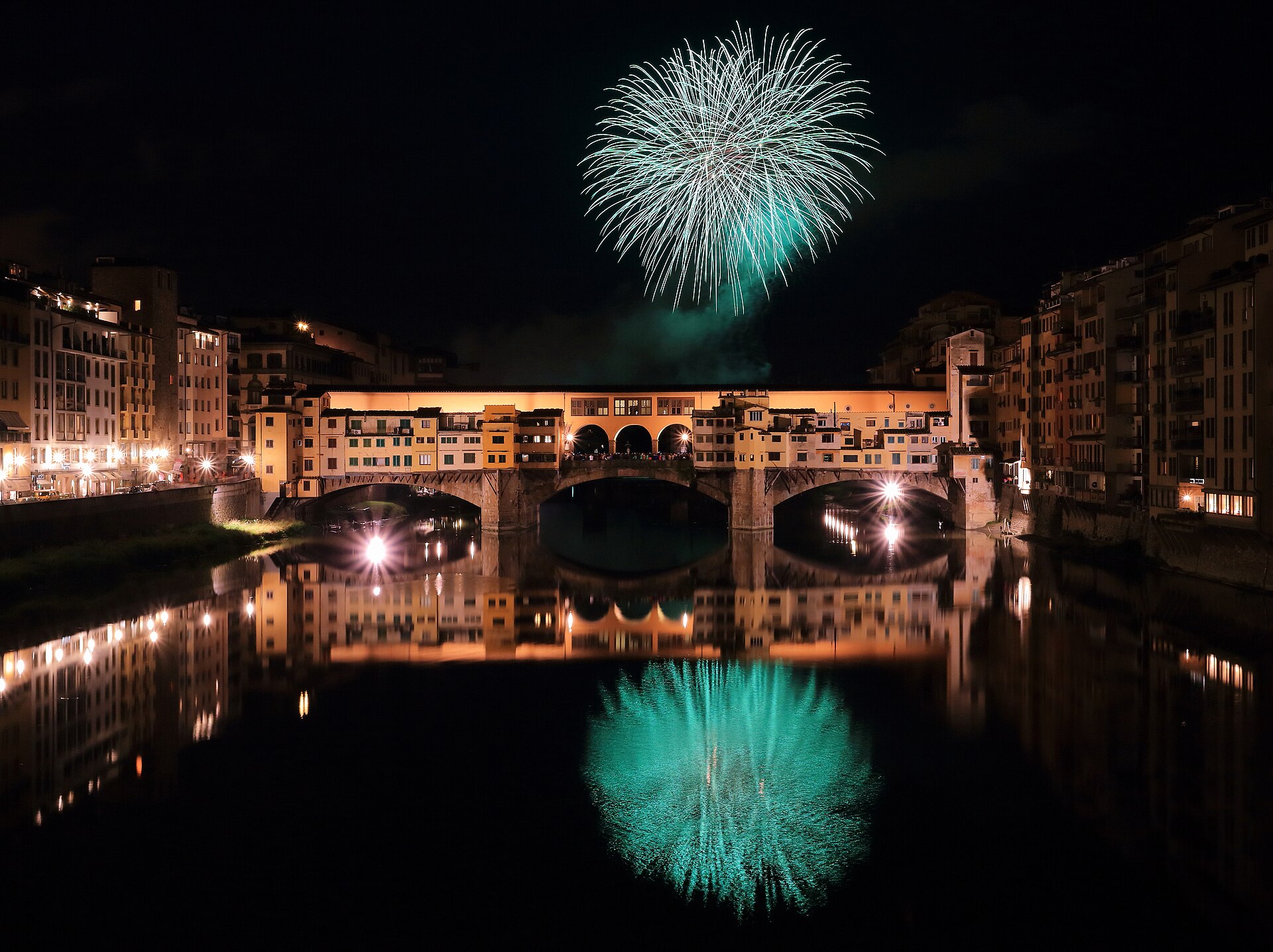Classic fireworks over a river — the entertainment baseline drones now compete with